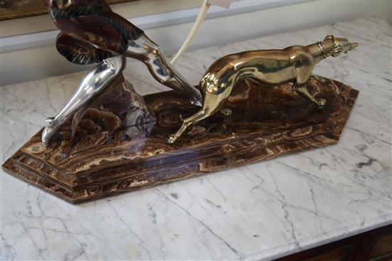 A French Art Deco silvered and painted model of a huntress, 23in.